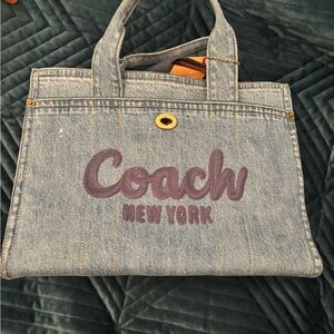 Coach Cargo Tote bag in denim with an embroidered logo.